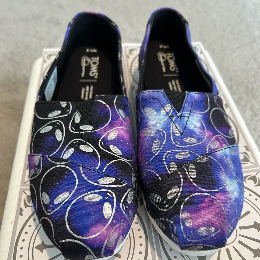 TOMS slip on shoes.